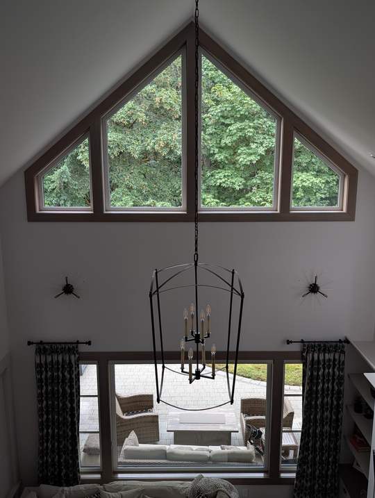 Interior gable windows and chandelier after cleaning